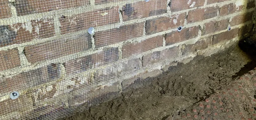 a rodent barrier on a wall